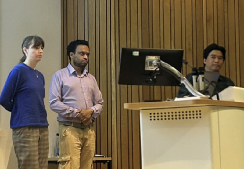 a photo of zitzmann lab presenting.