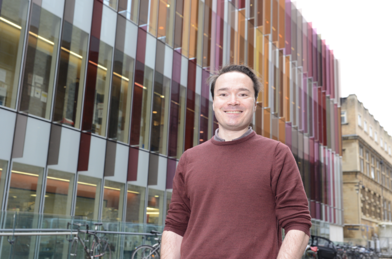 A photo of Simon Newstead in front of the DCH Building