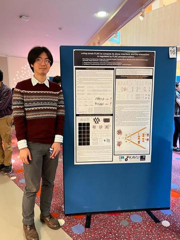 A picture of Zihao Wang with his poster.
