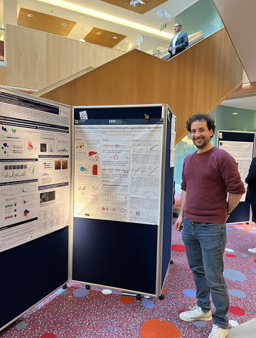 A photograph of Martino Bardelli with his poster.