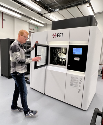 A photograph of Professor Matt Higgins using the Cryo-Em.