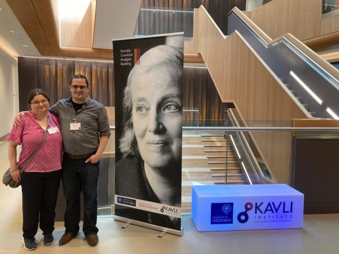 Family members of Dorothy Hodgkin with the poster of the building opening.