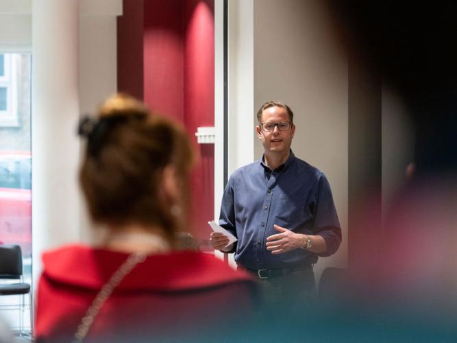 Professor Justin Benesch giving the speech during the ceremony to rename the 'Carol Robinson Seminar Room' at the 5th birthday symposium held by Oxford's Kavli Institute for Nanoscience Discovery.