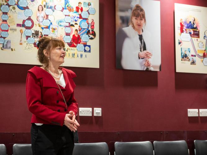  Professor Dame Carol Robinson standing in front of art work by Martin O'Neill at the 5th birthday symposium held by Oxford's Kavli Institute for Nanoscience Discovery.