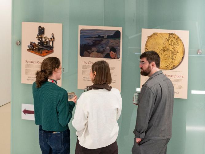 Treasa O'Hagan (Doctoral Student), Dr Emily Machala and Dr Jose Prius Mengual discussing the posters forming part of a pop-up ethics exhibition at the 5th birthday symposium held by Oxford's Kavli Institute for Nanoscience Discovery (Kavli INsD)