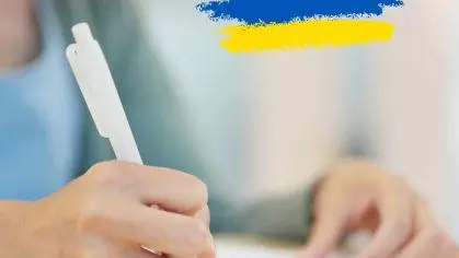 Close up photo of a pen holding hand
