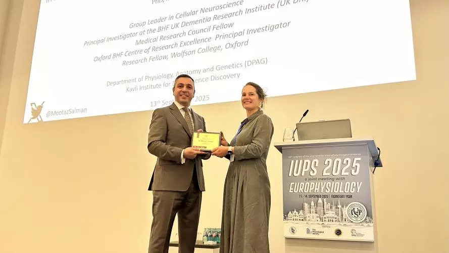 a photo of mootaz receiving his award