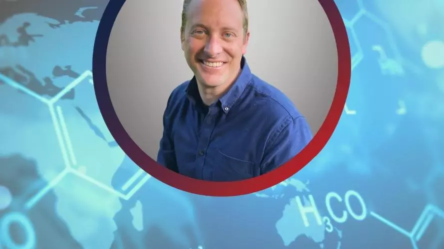 Picture of Doctor Weston Struwe on a blue background with chemical equations