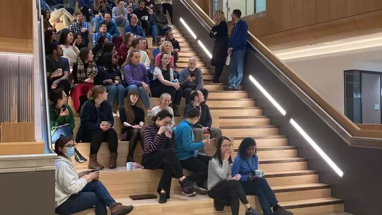 sleep talk audience sitting on the stairs of the atrium